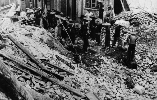 Searching for bodies after a a Japanese airstrike. Canton, 1938. Image from 