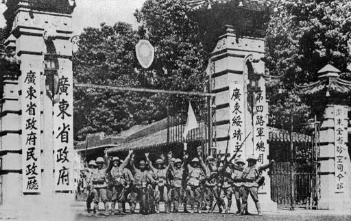 CANTON, CHINA - OCTOBER 21: Japanese soldiers celebrate their victory on October 21,1938 in Canton in front of the entrance of the seat of the Chinese Nationalist government after Japanese column of 3,000 men, led by tanks, stormed into Canton. Image from Getty Images.