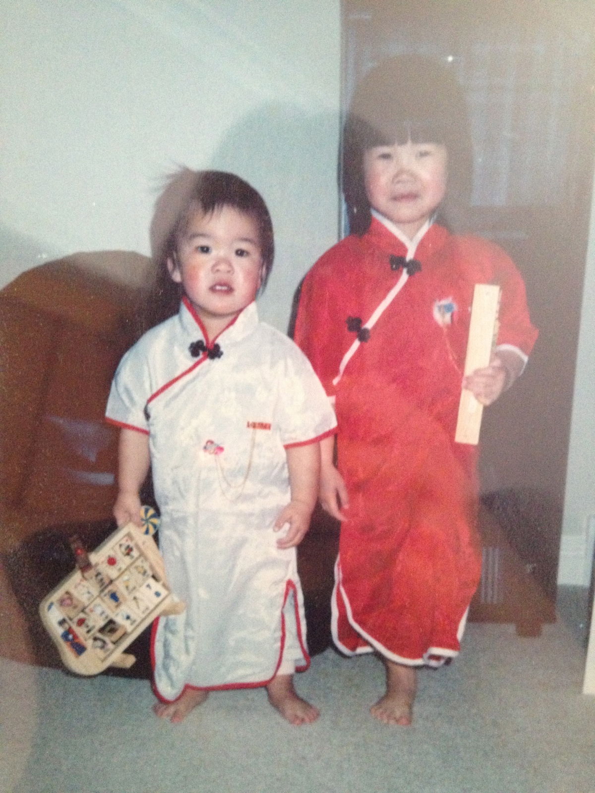 My big sis and I wearing qipao for the one time in our lives ever. 