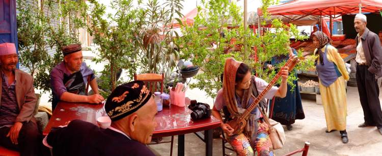 Jamming with the homies at a vegetable market in Kuche. Photo credit: Ben Allnatt.